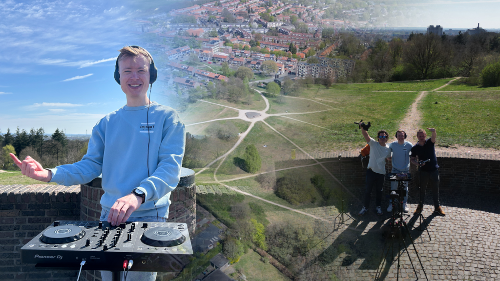 PresidentBrie performing an outdoor DJ set at Hoogte80 in Arnhem, mixing energetic tracks as the crowd enjoys the music under the open sky.