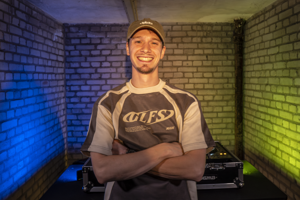 JØWØ performing a live DJ set, blending uplifting trance melodies with groovy rhythms, creating an energetic and flowing atmosphere on the dance floor.